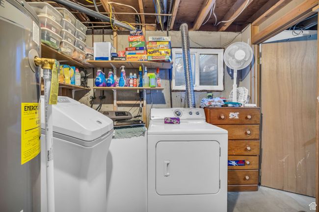 Laundry area featuring electric water heater, washer and dryer, and laundry area | Image 19