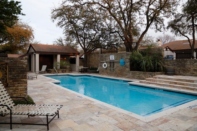 Community pool with a patio, an outbuilding, and an exterior structure | Image 23