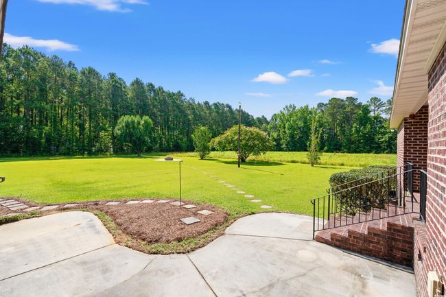 View of green lawn with a patio area | Image 20