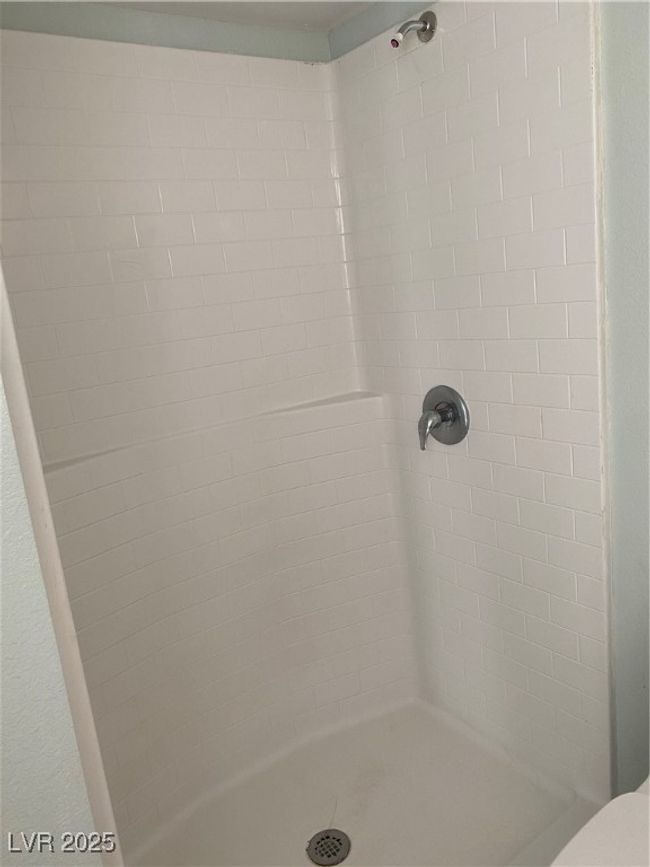 Full bath featuring toilet and a stall shower | Image 7