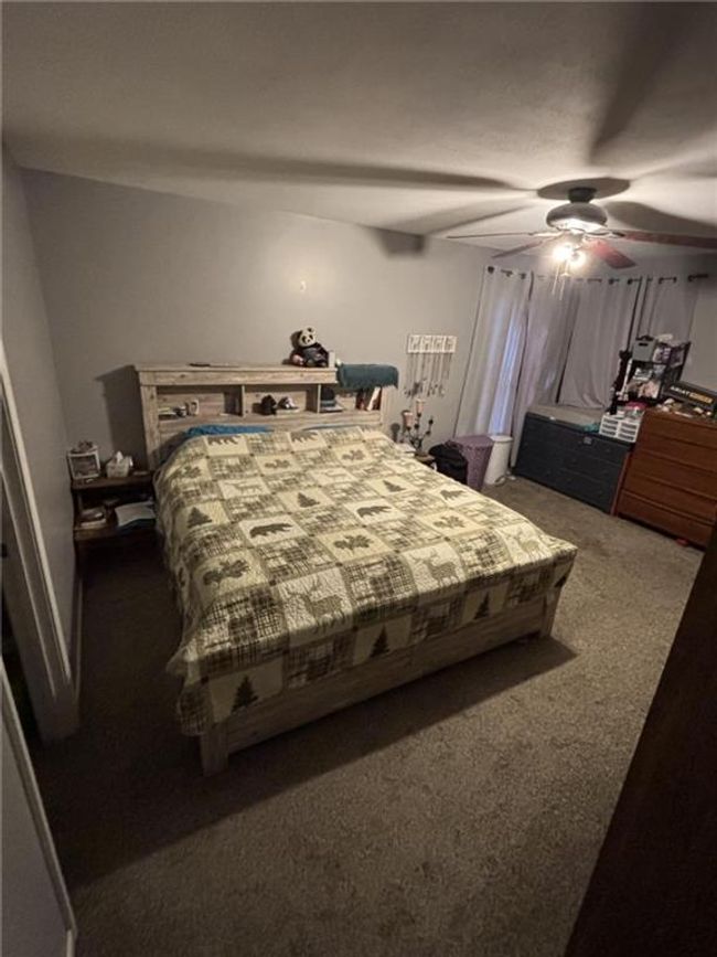 Carpeted bedroom with ceiling fan | Image 35