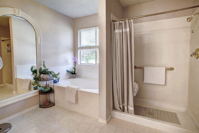 walk in shower with grab bars and garden tub | Image 20