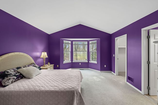 Spacious primary bedroom with cathedral ceiling | Image 14