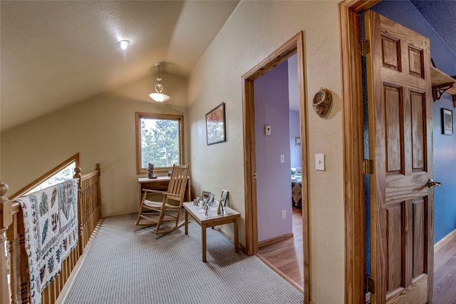 Hallway featuring lofted ceiling and light colored carpet | Image 26