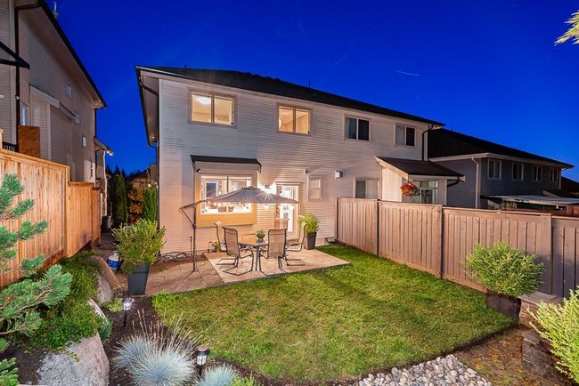 Back of house at twilight featuring a patio area | Image 30