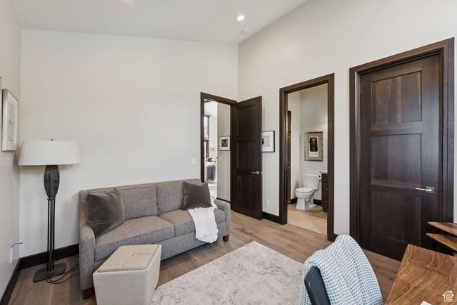 Living area featuring light wood-type flooring, recessed lighting, and lofted ceiling | Image 40