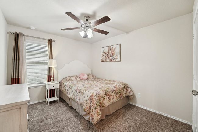 Carpeted bedroom featuring baseboards and ceiling fan | Image 17