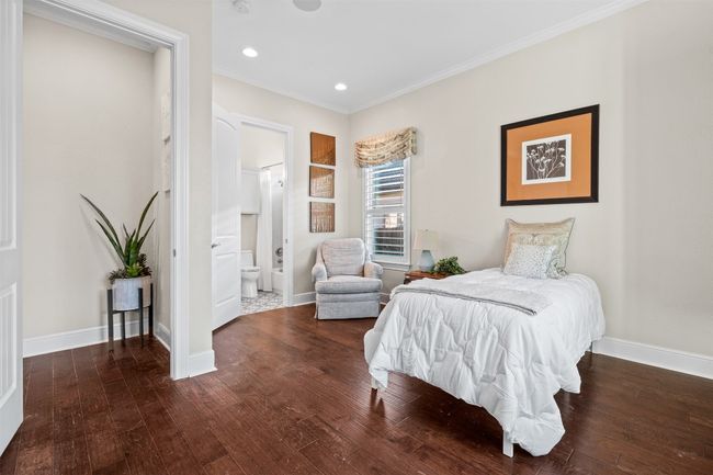 Complete with its own full bathroom, this serene space allows for both comfort and privacy—ideal for visitors or extended family. | Image 25