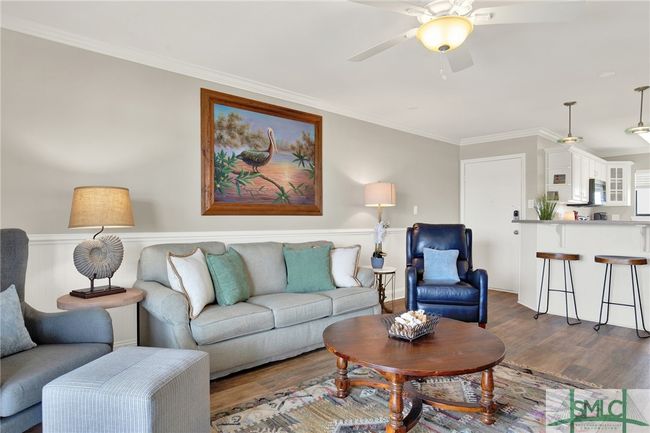 Living Room open to Kitchen & Dining Area with Sliding Glass Door to Spacious Balcony | Image 4