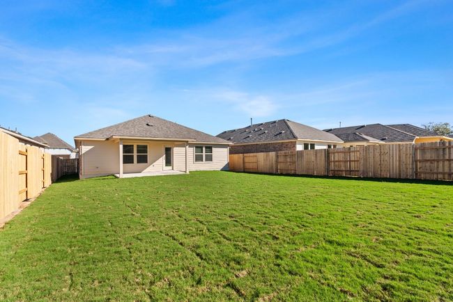 Back of house with a fenced backyard and a lawn | Image 26