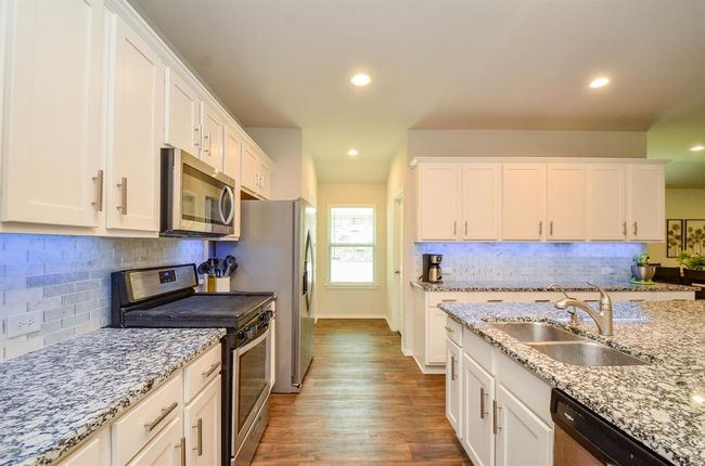This Designer backsplash will surely impress you! You can change the color of the undermount lights! | Image 8