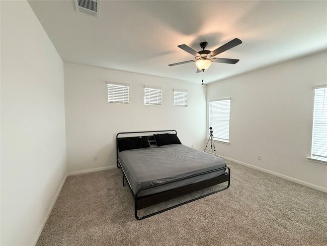 Carpeted bedroom featuring baseboards and a ceiling fan | Image 15