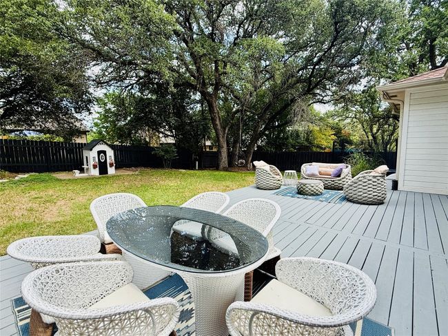Wooden deck with outdoor dining area and outdoor lounge area | Image 25