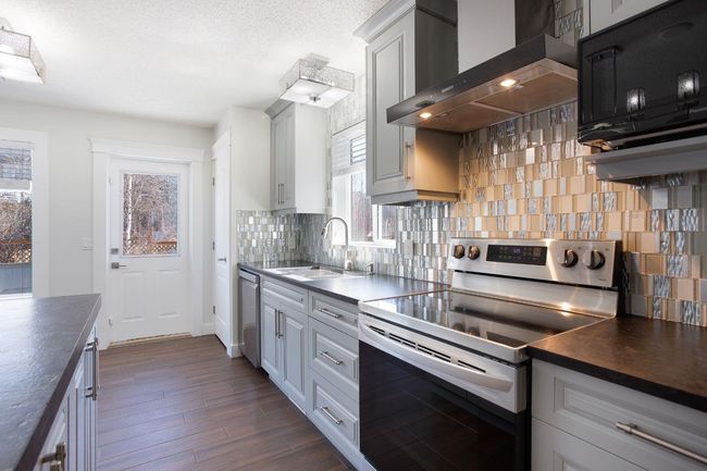 432 Rocky Ridge Drive Nw, House other with 5 bedrooms, 3 bathrooms and 4 parking in Calgary AB | Image 7