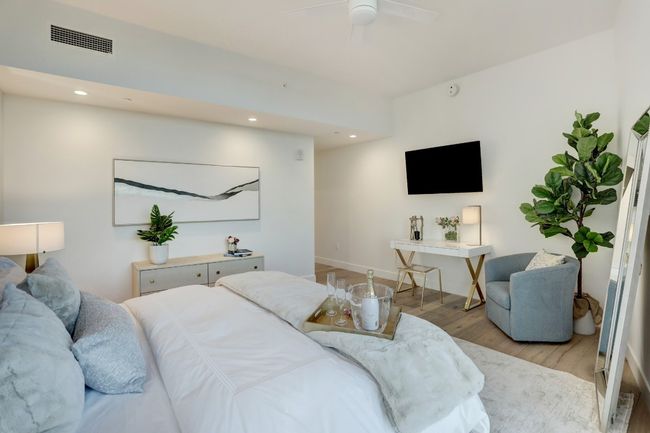Primary suite is tucked away from the entertainment space in the rear wing of the property. Featuring a very spacious walk-in closet. | Image 19