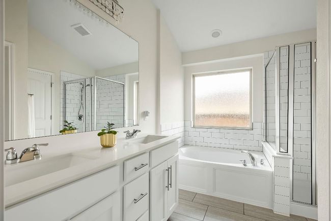 Sleek finishes and modern fixtures add a spa-like feel. | Image 15