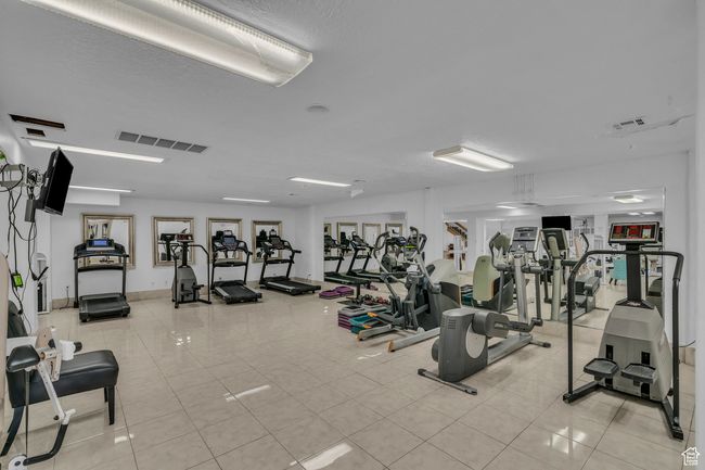 Gym featuring tile patterned floors | Image 22