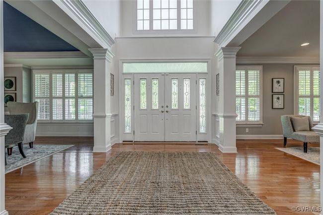 Step into a grand two-story foyer flanked by formal living and dining room. | Image 6
