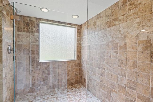 Frosted glass inside the shower lets in lots of gorgeous sunlight while still maintaining privacy and safety. | Image 28