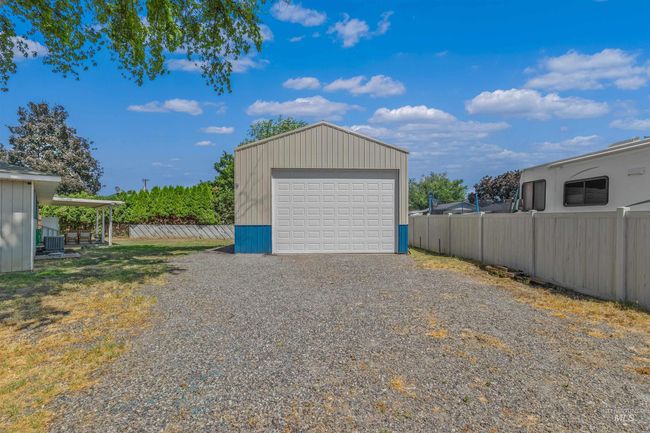 Detached garage featuring driveway | Image 31