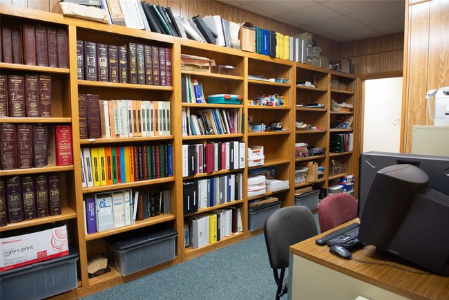 Office featuring wooden walls and washer / clothes dryer | Image 11