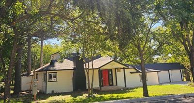 View of front facade featuring a garage | Image 1