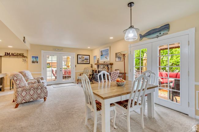 Dining space with light carpet, french doors, and recessed lighting | Image 17