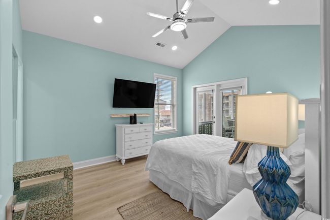 Bedroom featuring a ceiling fan, visible vents, recessed lighting, wood finished floors, and baseboards | Image 26