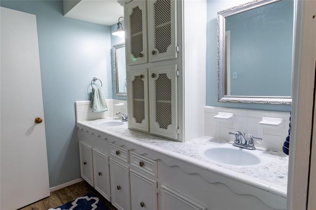 View of upstairs bath from tub area. | Image 18