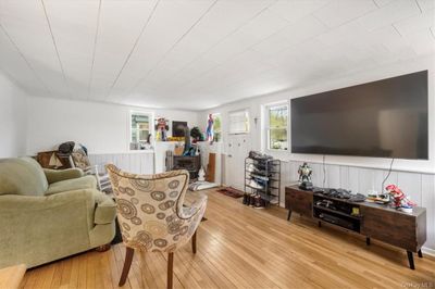 Living room with light hardwood / wood-style flooring | Image 3