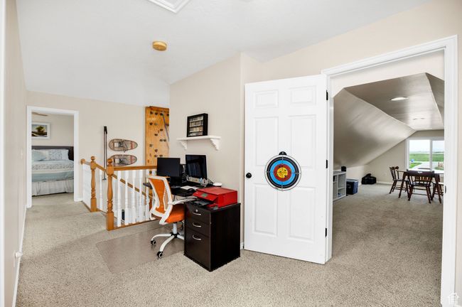 Office area with carpet floors, lofted ceiling, and baseboards | Image 12