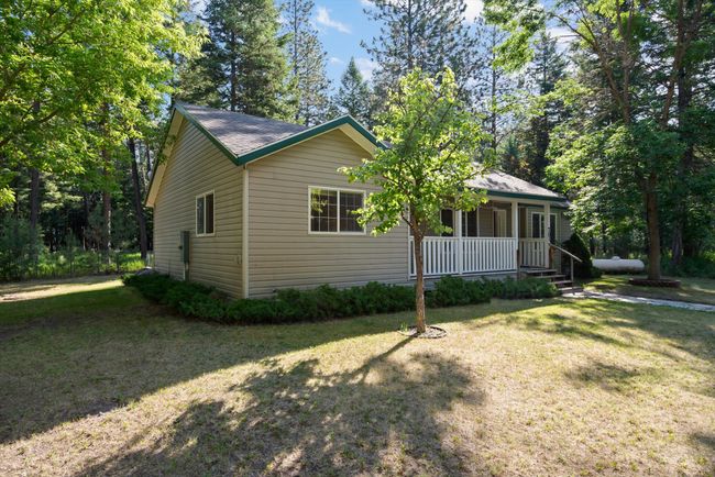 View of front of property with covered porch and a front lawn | Image 4