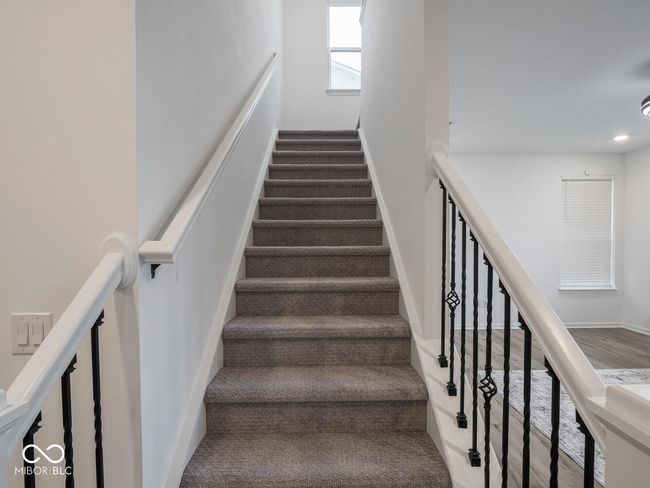 stairway with wood finished floors, baseboards, and recessed lighting | Image 26