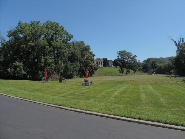 Surrounding community with a lawn and fence | Image 14