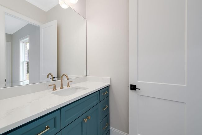 Bathroom featuring vanity and baseboards | Image 37