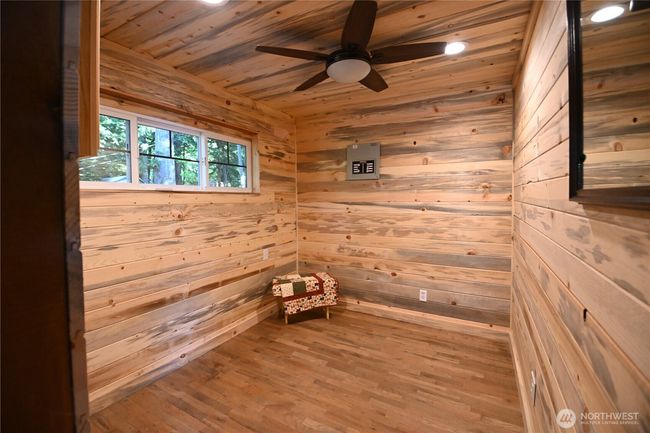 Bdrm ~ pleasing wood interior, window and remote operated fan/lighting. | Image 18