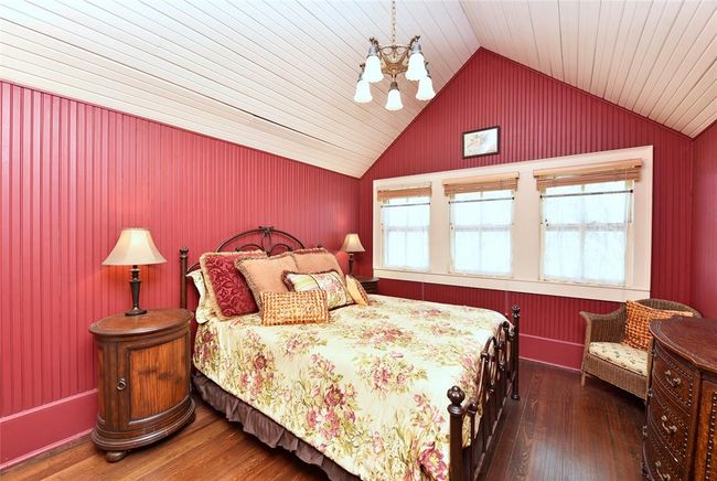 This bedroom is one of the upstairs bedrooms in the Main house. There are unique ceilings in this home in every room. | Image 21