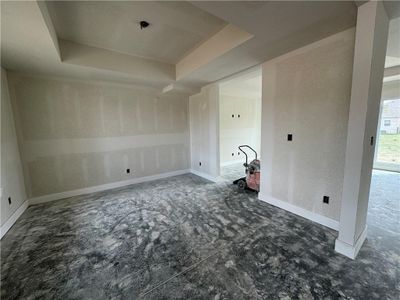 Spare room with a tray ceiling | Image 2