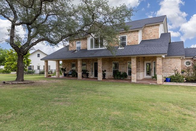 Front of house with detached workshop in the distant view here. | Image 6