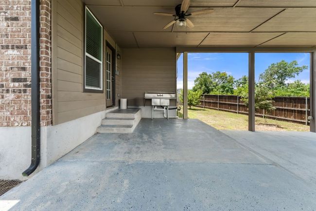 View of patio featuring a ceiling fan | Image 30