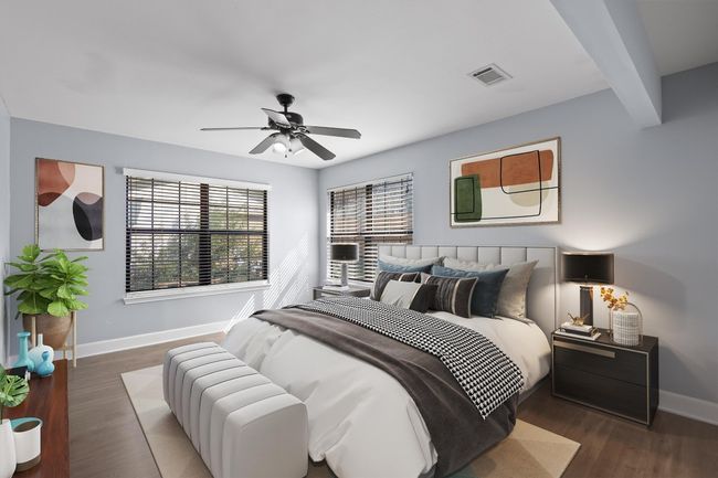 Bedroom with beamed ceiling, visible vents, wood finished floors, baseboards, and ceiling fan | Image 24