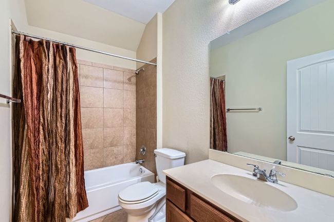 Full bathroom with vanity and shower / tub combo with curtain | Image 23