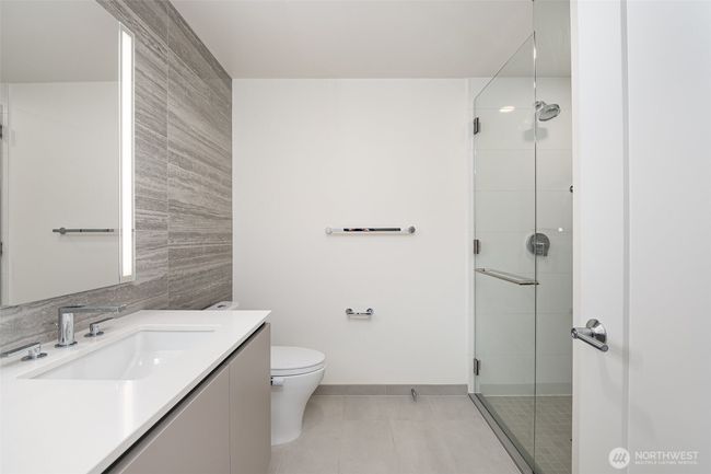Stacked washer/dryer is also located in the bathroom behind the door. | Image 14