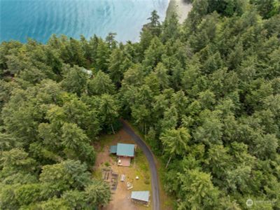 Aerial of shop, pumphouse, garden and upper parking area | Image 3