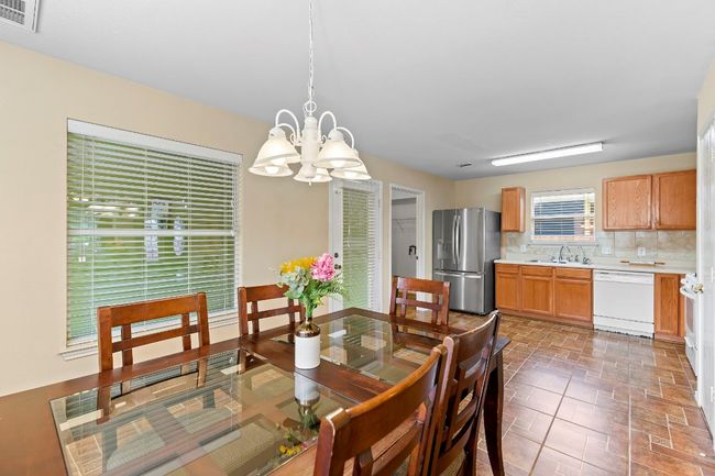 Dining room featuring a chandelier | Image 15