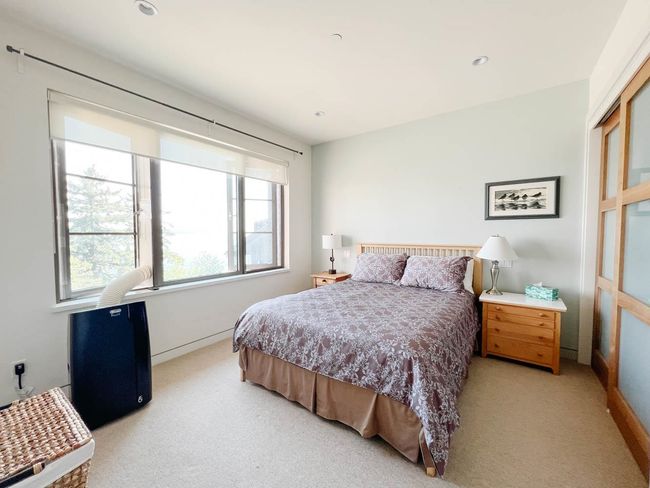 Bedroom with light carpet and recessed lighting | Image 31