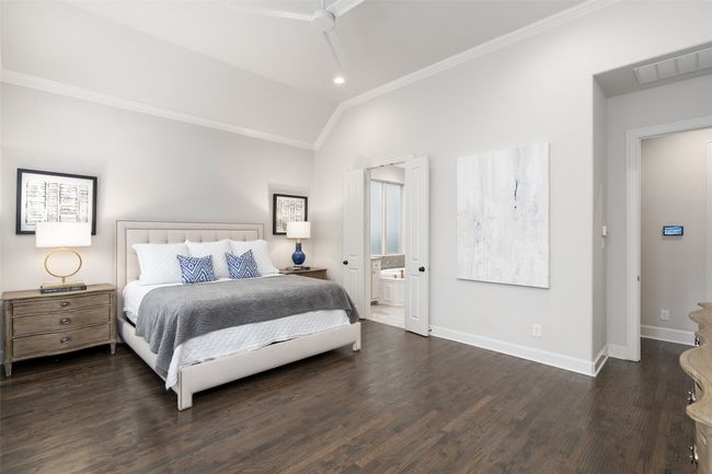 Primary features en suite spa like bath and hand scraped hardwood flooring with upgraded ceiling fan and recessed lighting. | Image 19