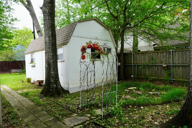 View of shed featuring a fenced backyard | Image 24