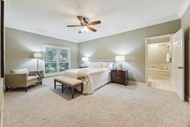 The 19’x13’ primary bedroom is located on the first floor with windows facing the front of the home. | Image 18