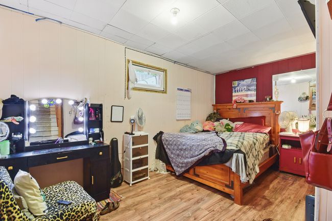 Bedroom with wood finished floors | Image 23
